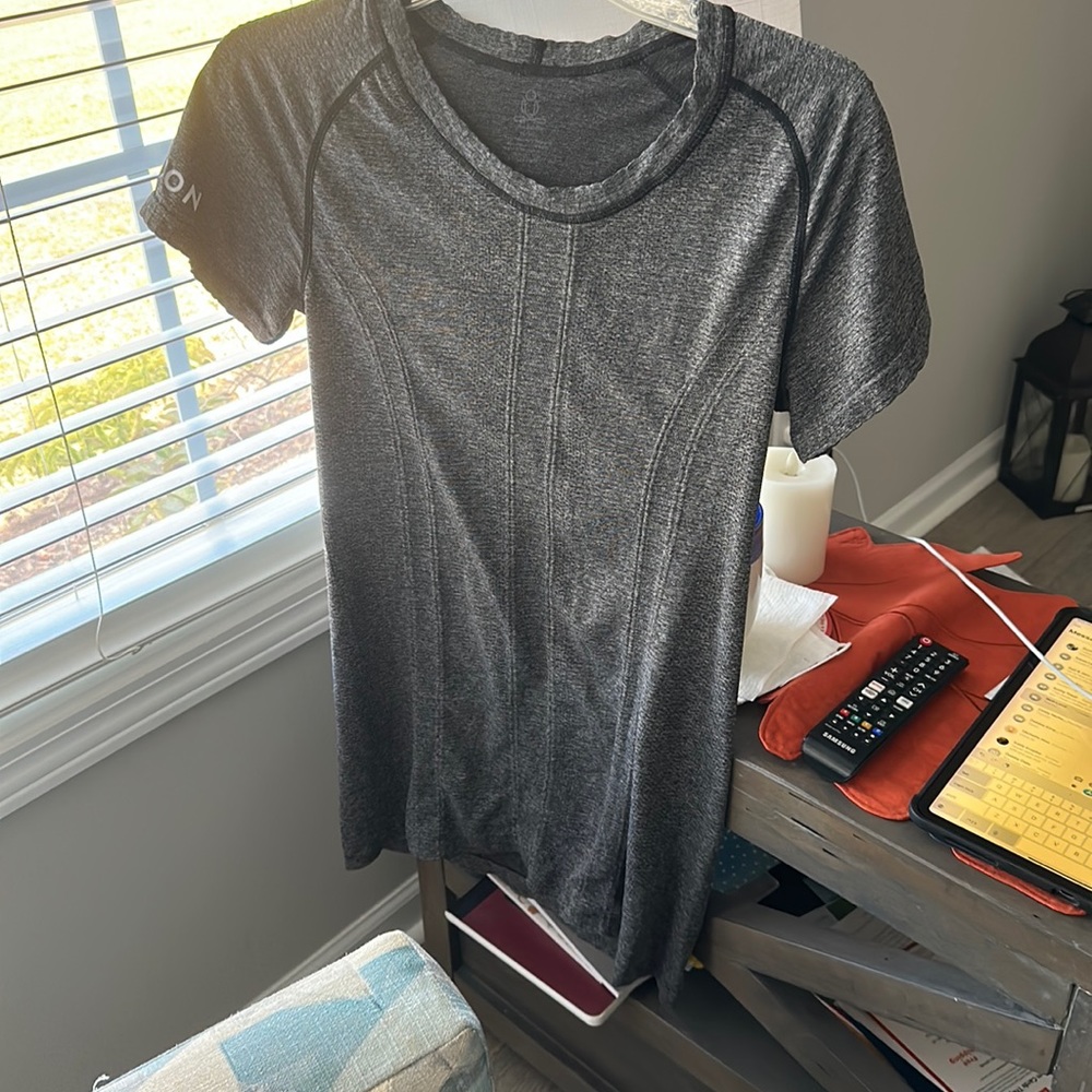 Peloton women’s large T-shirt. Brand new never worn. 58% nylon 42%polyester.
